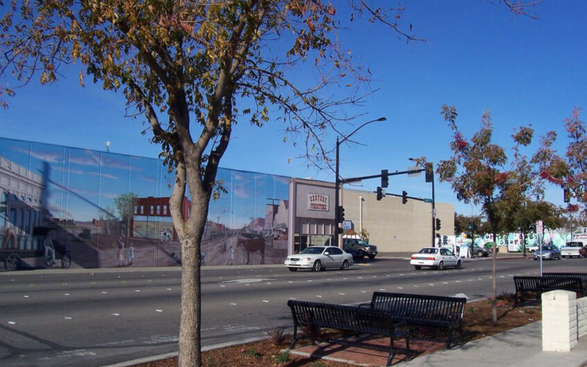 Image of a mural in Manteca, CA showing downtown revitalization, and new commercial projects.